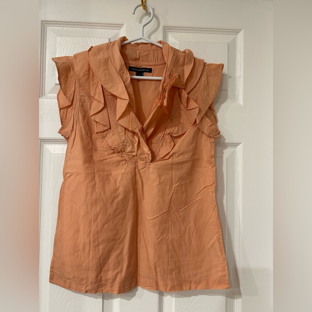 Peach color sleeveless blouse